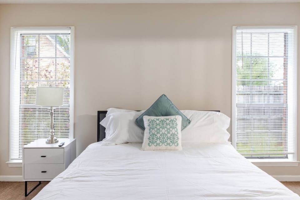 Bedroom at Whispering Oaks with a queen bed and its own bathroom.