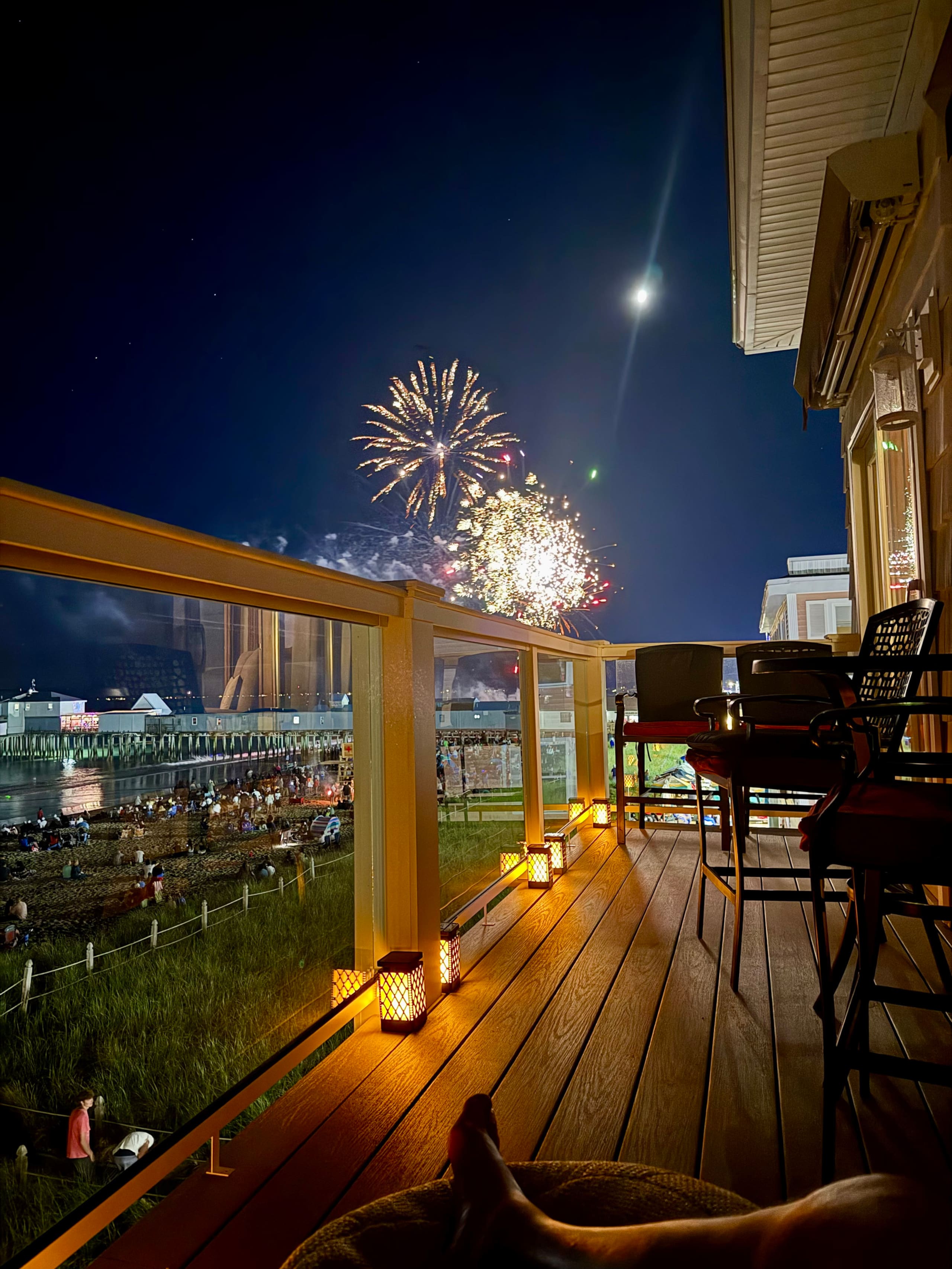 Fireworks over Old Orchard Beach pier at night, view from the balcony