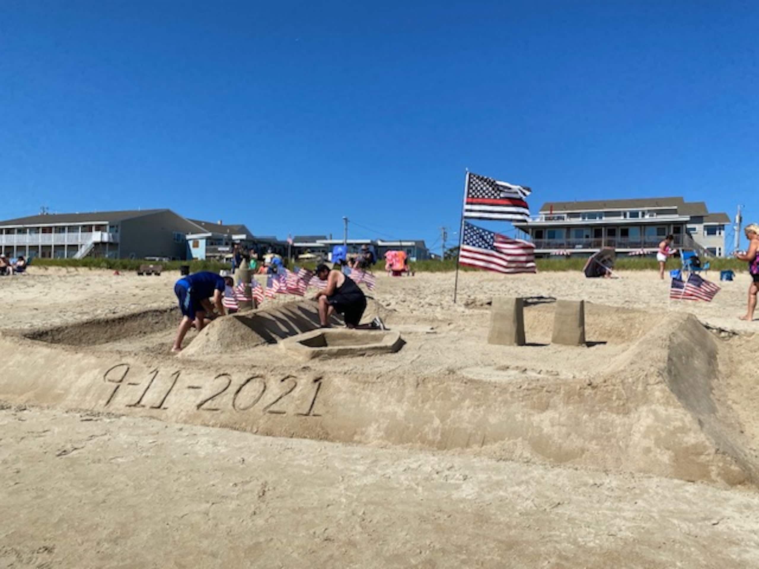 Sand sculpture memorial on the beach