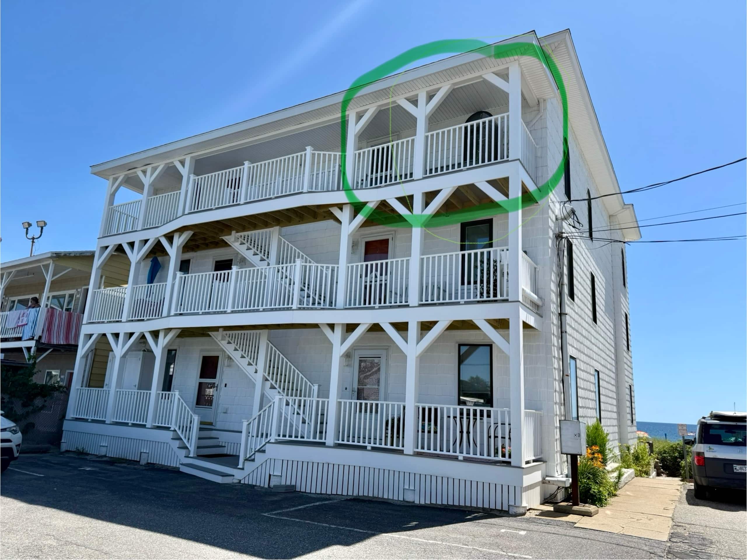 Exterior of the condo building showing the top-floor unit